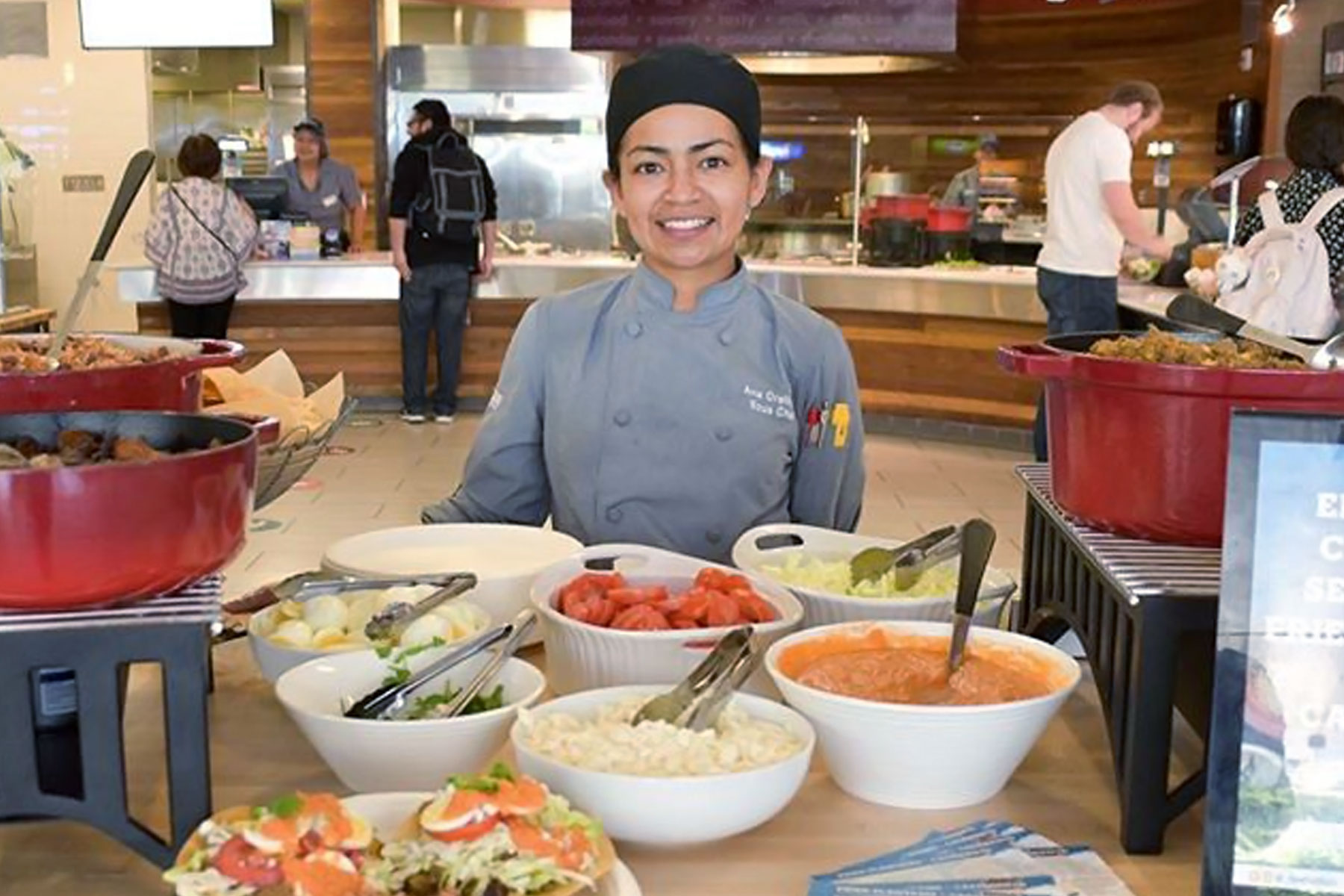 Spartan Eats employee serving food at the Student Union.