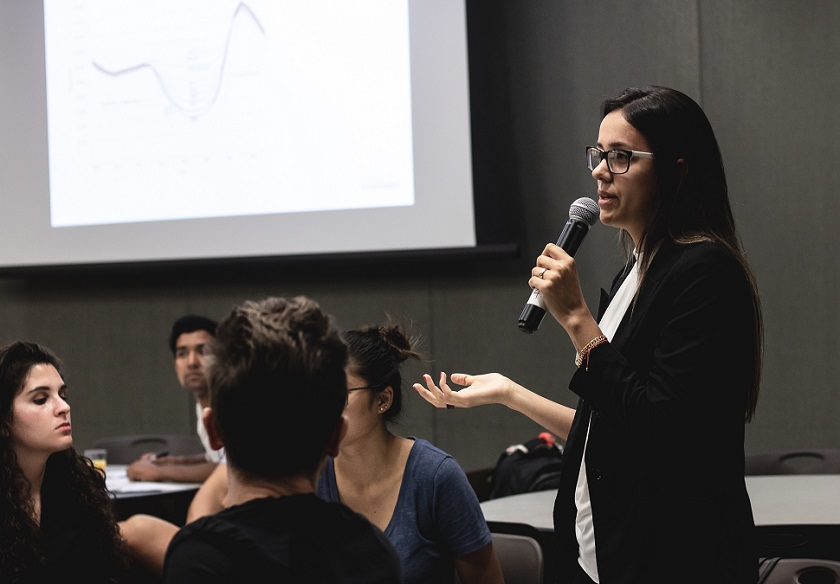 woman holding mic at workshop