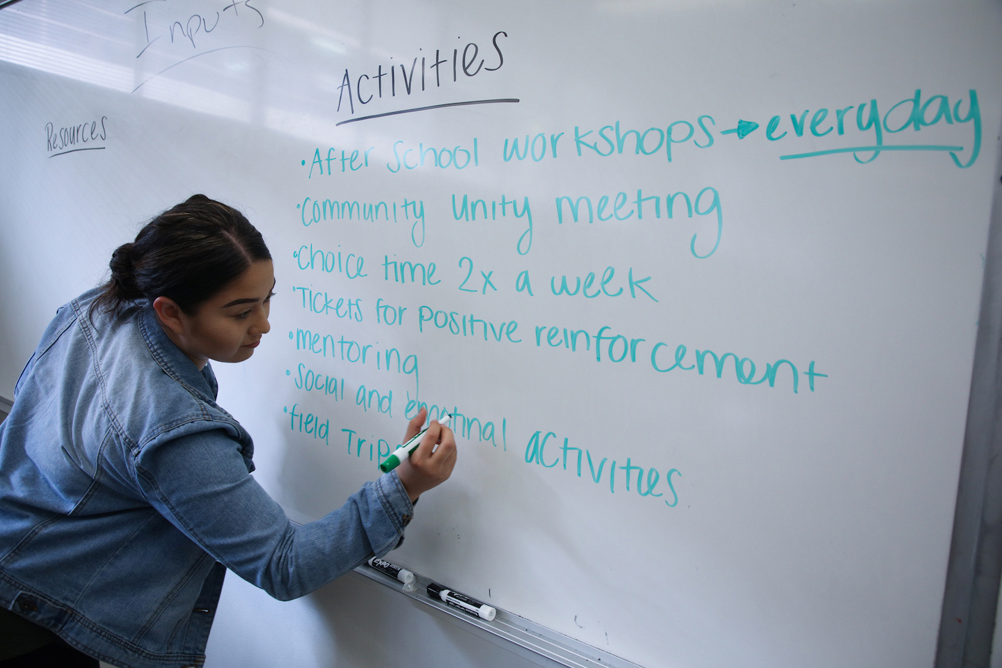 ChAD student writing on a whiteboard