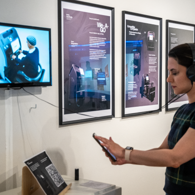 Person scanning QR code with phone.