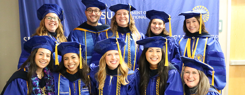 group of OTD student graduates with their caps and gown