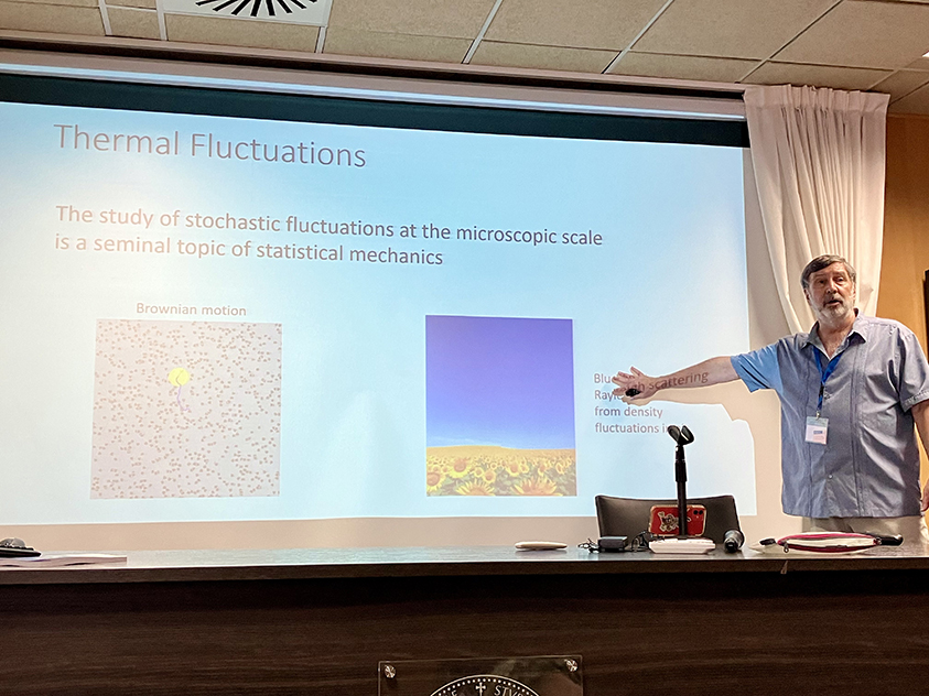 Photograph of Alejandro Garcia giving a physics talk.