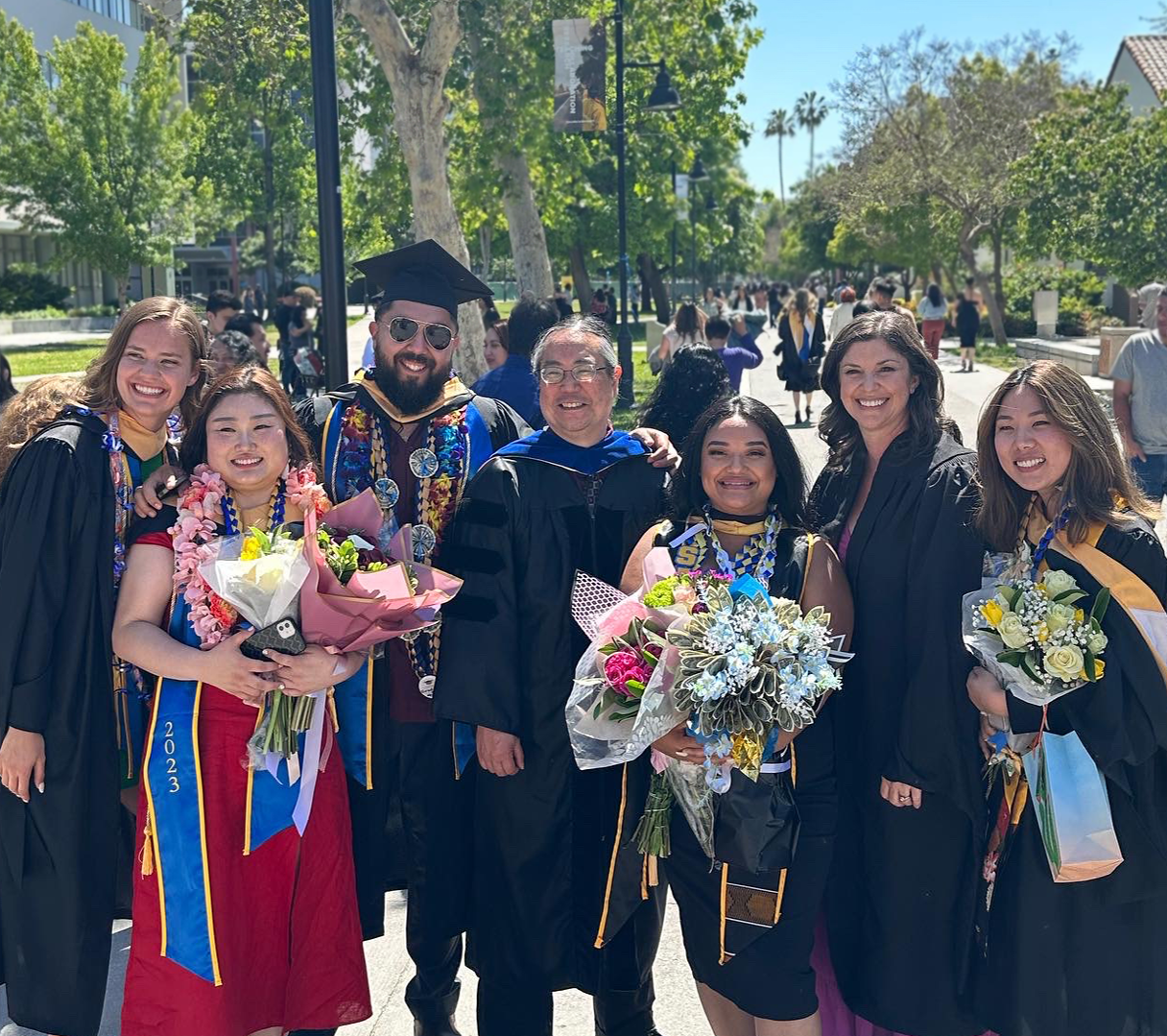 students of School of social work at graduation with Dr. Peter Lee