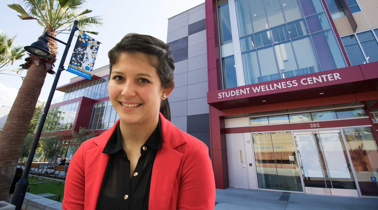 Student stand in front of Student Health Center